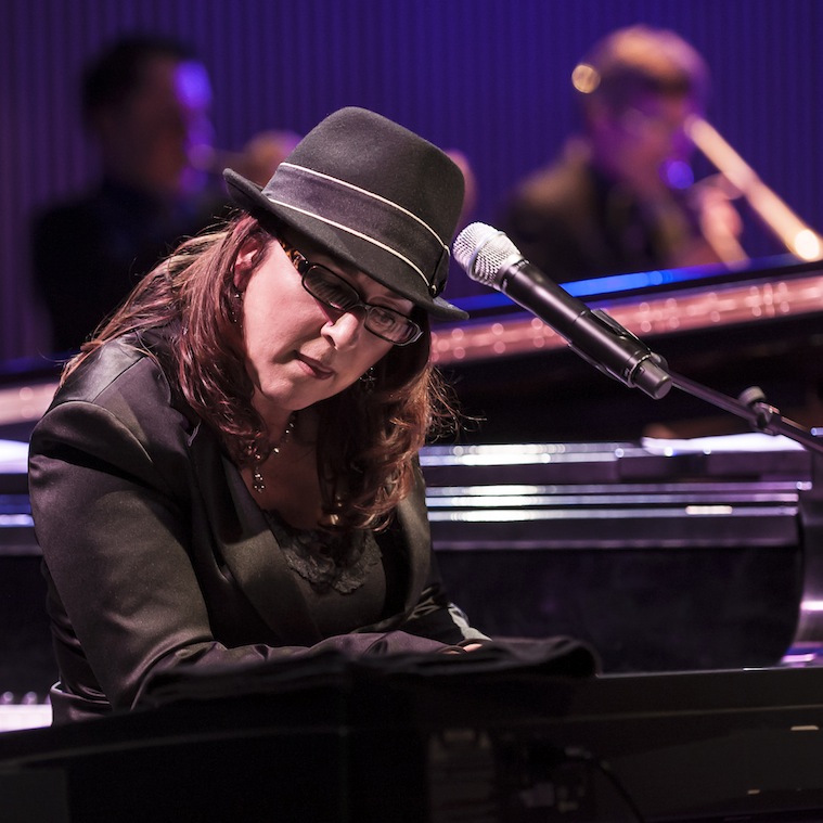 Rebeca Mauleon playing piano in live concert.