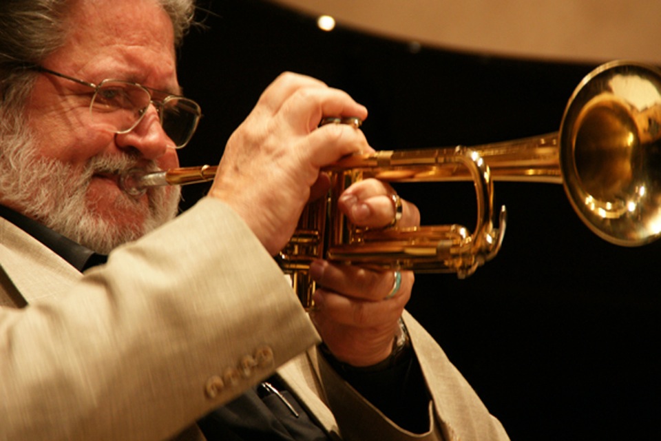 Bobby Shew playing trumpet in concert.